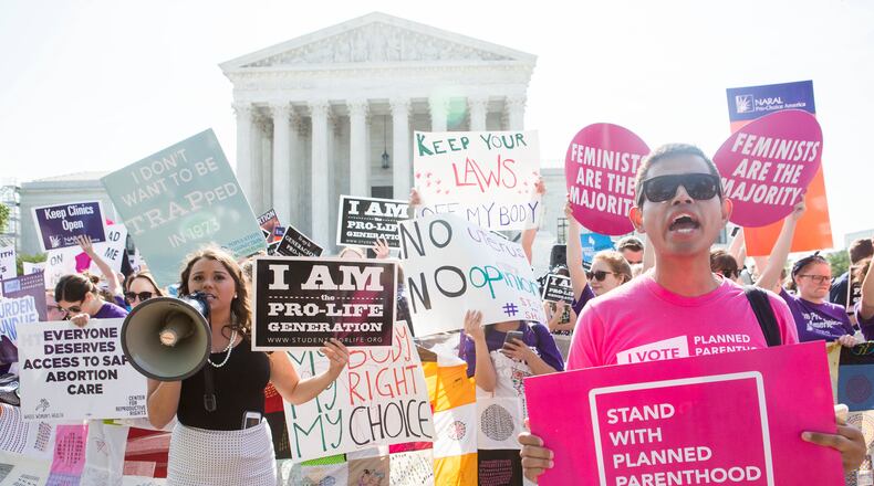 Pro-abortion rights and anti-abortion protesters rally in front of the U.S. Supreme Court in Washington, June 27, 2016. The court finished its term with a decision on abortion – a case deciding the constitutionality of two provisions of a Texas law regulating abortion could affect access to abortions for millions of women in several states.
