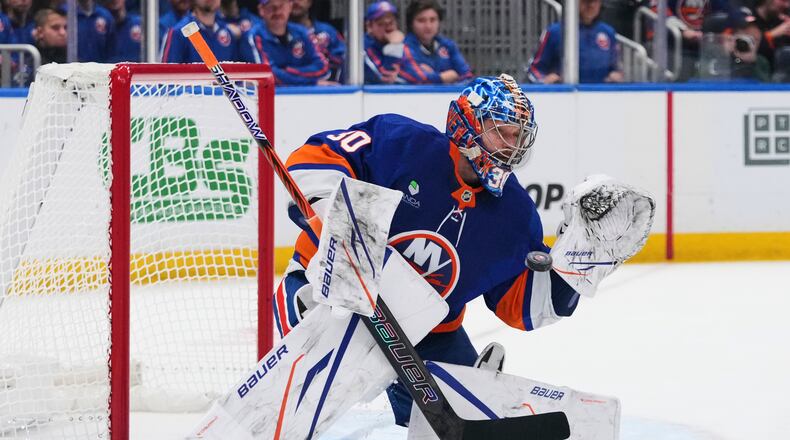 New York Islanders goaltender Ilya Sorokin (30) stops a shot during the second period of an NHL hockey game against the New Jersey Devils Tuesday, Jan. 6, 2026, in Elmont, N.Y. (AP Photo/Frank Franklin II)