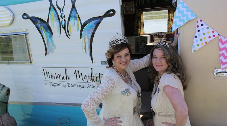 Owner Marcie Brow, left, and Business Partner/Creative Director Ashley Smith outside their business-on-the-go RV for Monarch Markets. The business also has a brick-and-mortar building in downtown Springboro.