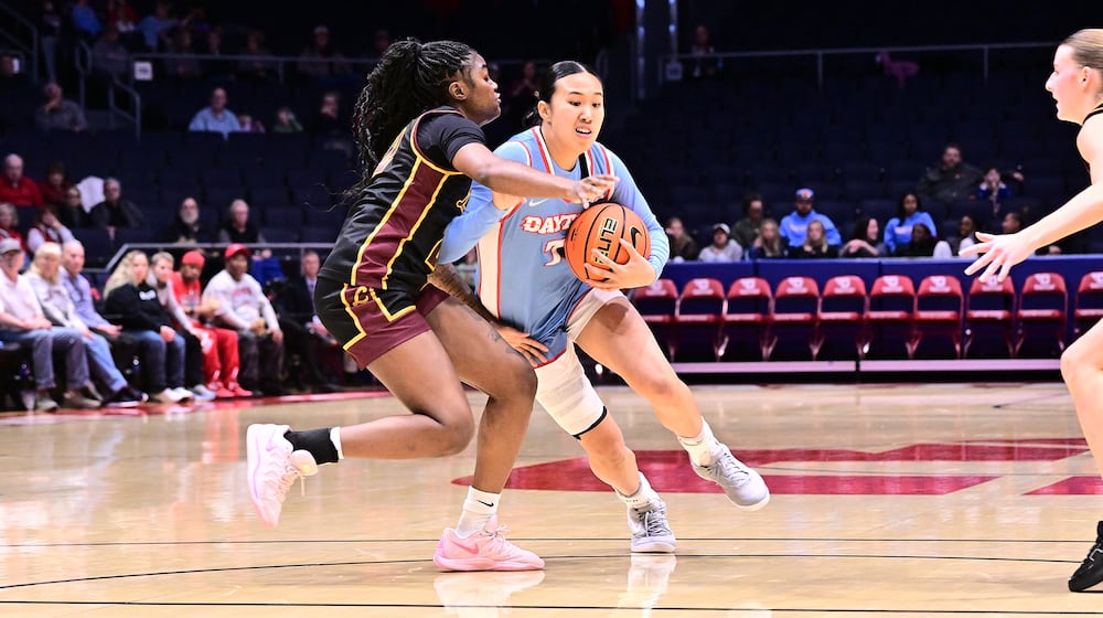 Dayton's Olivia Leung tries to drive past a defender during their game against Loyola Chicago on Wednesday, Jan. 7, 2026 at UD Arena. ERIK SCHELKUN / CONTRIBUTED PHOTO