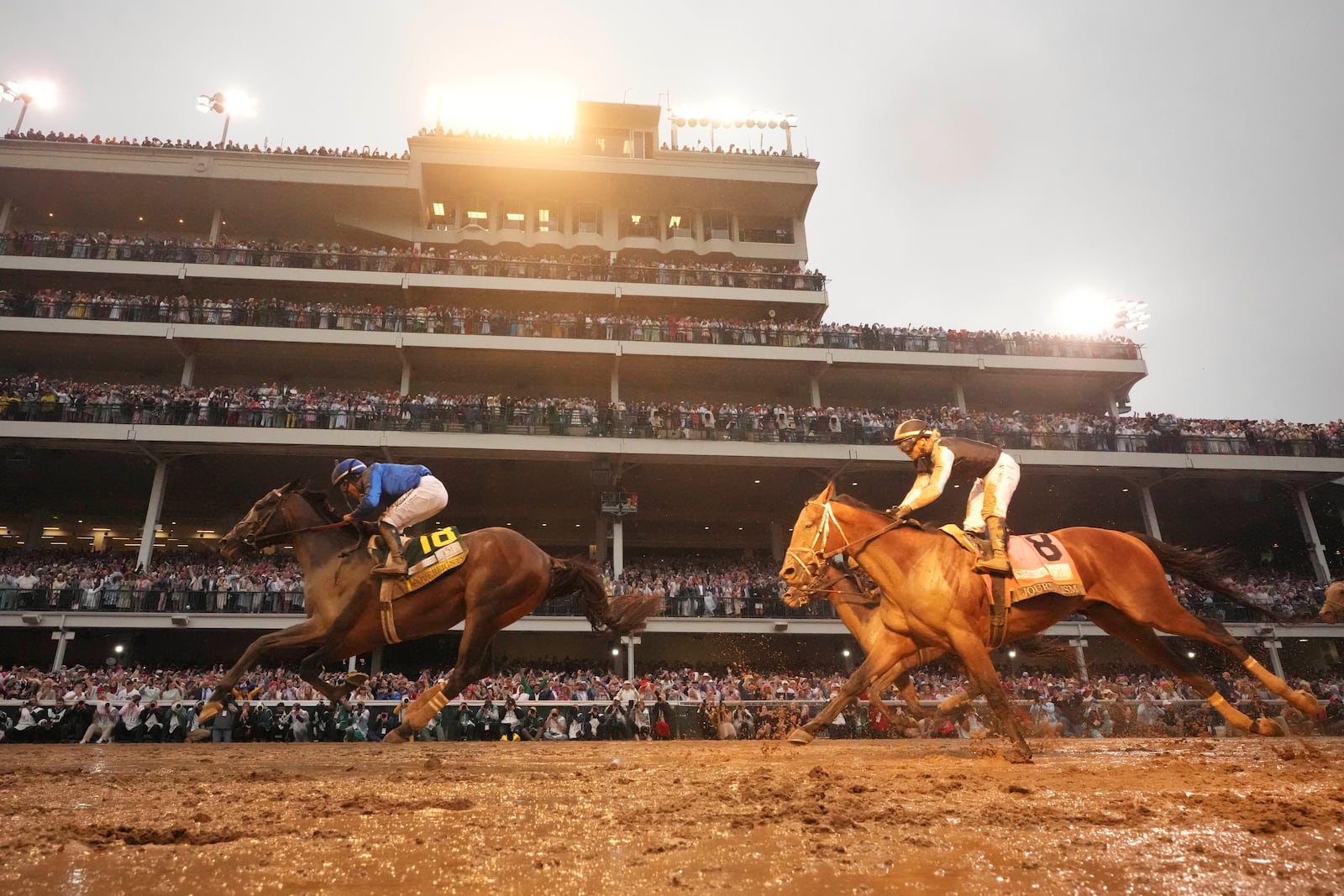 Sovereignty, ridden by Junior Alvarado, left, crosses the finish line to win the 151st running of the Kentucky Derby horse race at Churchill Downs Saturday, May 3, 2025, in Louisville, Ky. (AP Photo/Abbie Parr)