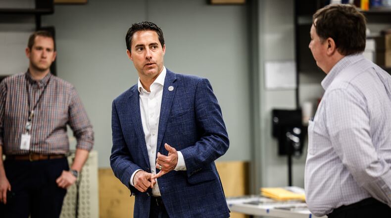 Director of the Montgomery County Board of Elections, Jeff Rezabek, right, fields questions by Ohio Secretary of State, Frank LaRose at the Montgomery County Board of Elections on Monday May 2, 2022.