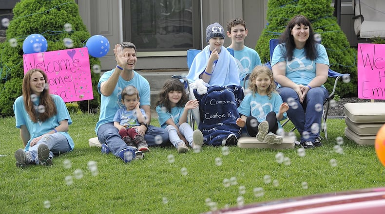 The community of Lebanon participated in a Welcome Home Parade for Emma Palmer Friday. Members of Emma s swim team, classmates, teachers, friends and family took part in the parade along with the police and fire departments. Emma collapsed on the pool deck during swim practice on Jan. 28, leaving her unconscious and unresponsive. She was life-flighted to the Children’s Hospital in Cincinnati for a spontaneous brain bleed. MARSHALL GORBYSTAFF