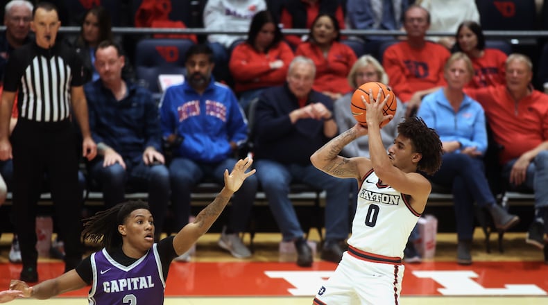 Dayton's Javon Bennett shoots against Capital on Saturday, Nov. 16, 2024, at UD Arena. David Jablonski/Staff