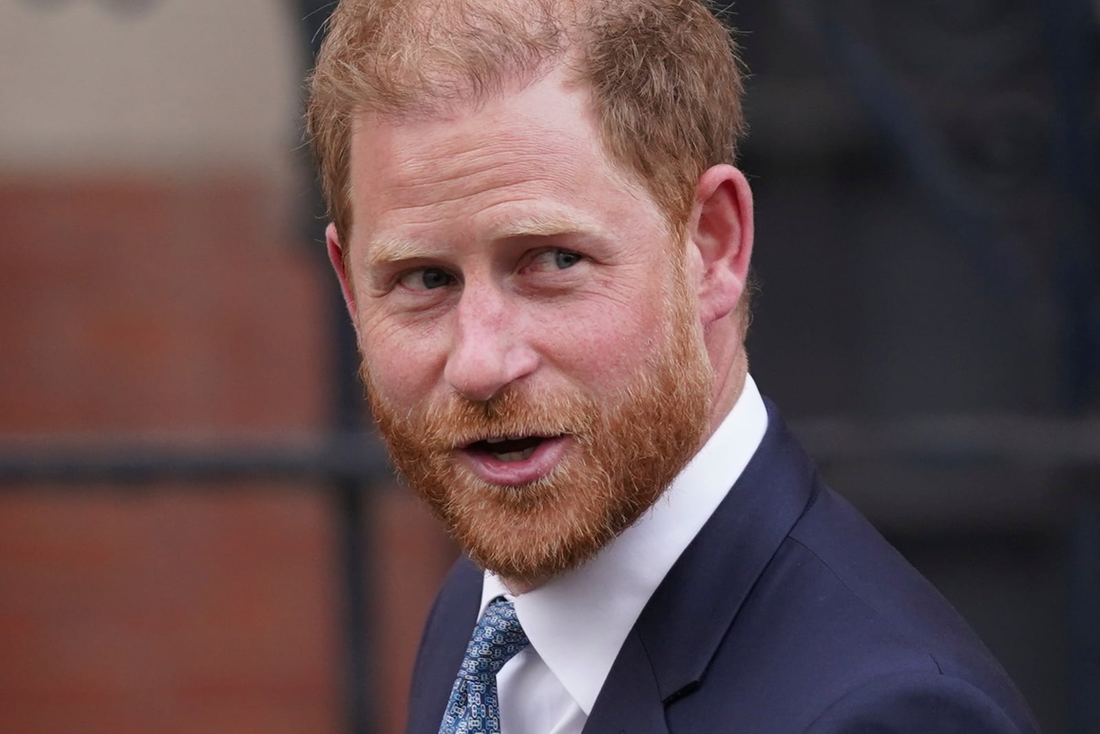 Britain's Prince Harry looks towards the media as he leaves the Royal Courts of Justice in London, Tuesday, April 8, 2025. (AP Photo/Alberto Pezzali)