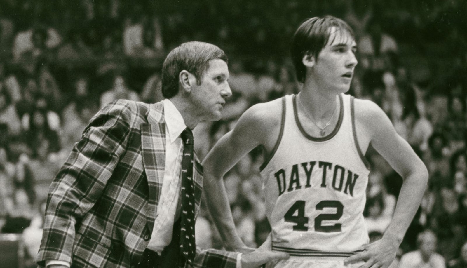 Jim Paxson, right, is pictured with Dayton coach Don Donoher in the 1970s. Dayton Daily News file photo