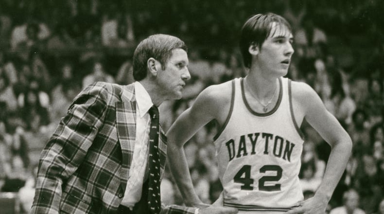 Jim Paxson, right, is pictured with Dayton coach Don Donoher in the 1970s. Dayton Daily News file photo