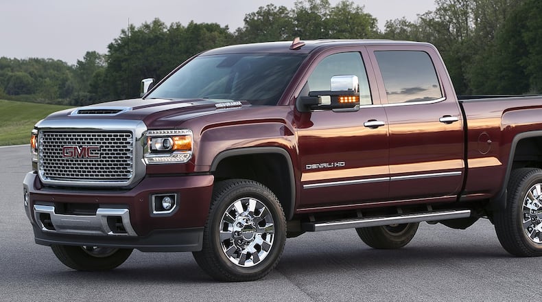 The 2017 GMC Sierra Denali is offered exclusively as a crew cab and includes a signature chrome grille, 18-inch chrome aluminum wheels (17-inch polished aluminum with dual rear wheels), body-color front and rear bumpers, specific interior details, exclusive 8-inch customizable driver display, wireless phone charging and more. GMC photo