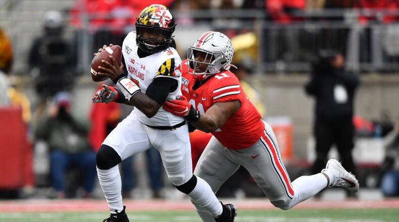 COLUMBUS, OH - NOVEMBER 9: Tyreke Smith #11 of the Ohio State Buckeyes chases down quarterback Tyrrell Pigrome #3 of the Maryland Terrapins for a sack in the second quarter at Ohio Stadium on November 9, 2019 in Columbus, Ohio. (Photo by Jamie Sabau/Getty Images)