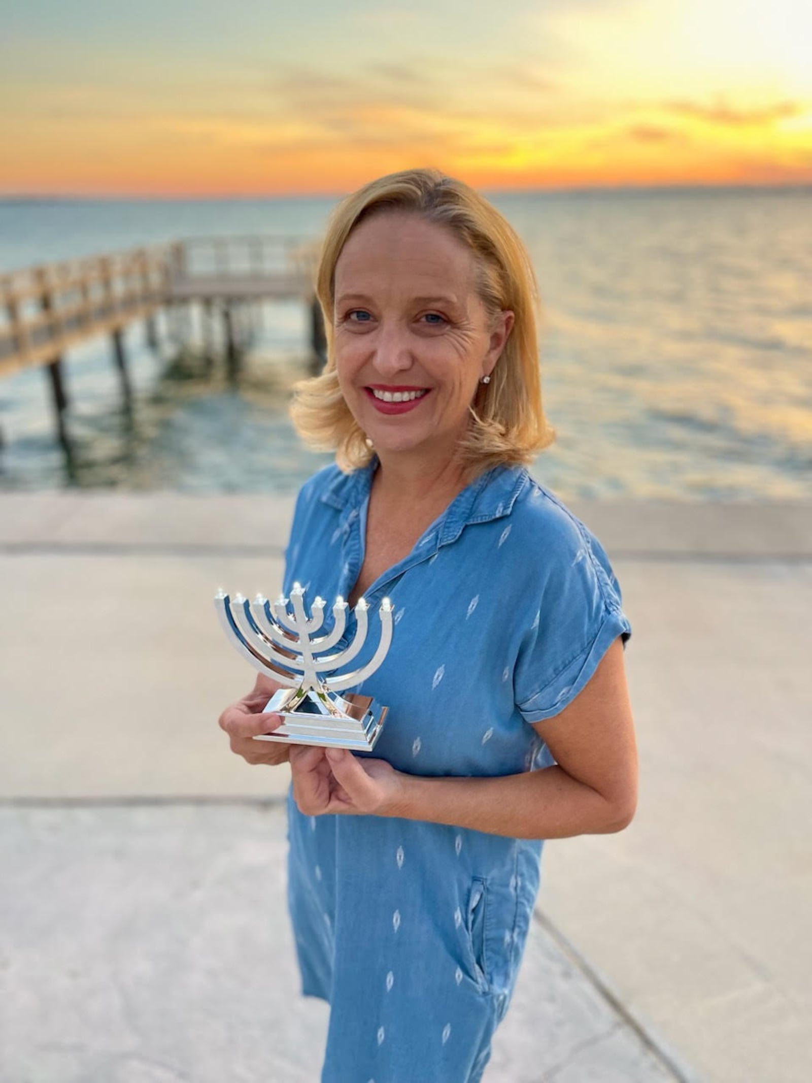 When Jennifer Marshall heard that her Jewish friend, Adam, was nervous about displaying a menorah, she bought one on Amazon to display in her window. CONTRIBUTED