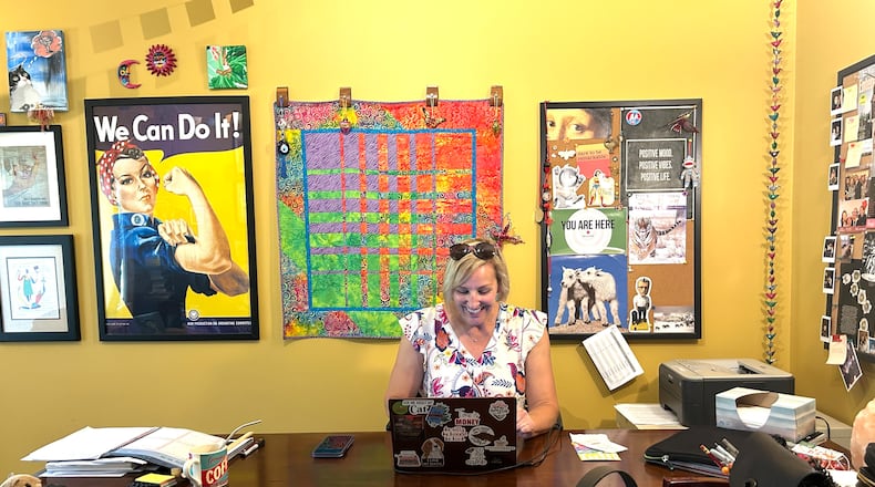 Katrina Kittle’s home writing office is hung with artwork and mementos from fellow cancer-survivor friends. CONTRIBUTED PHOTOS