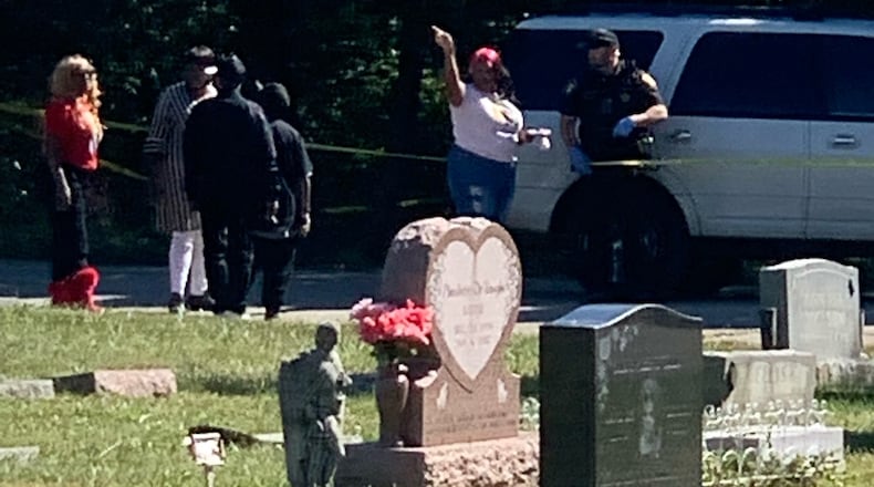 A portion of Jefferson View Cemetery was surrounded by yellow crime tape on Friday, Sept. 30, 2022, as Montgomery County Sheriff's deputies investigated a shooting. The sheriff's office said one family member shot another in the leg following an argument during the burial of a relative at the cemetery off South Union Road in Jefferson Twp. DAMON WOODS/STAFF