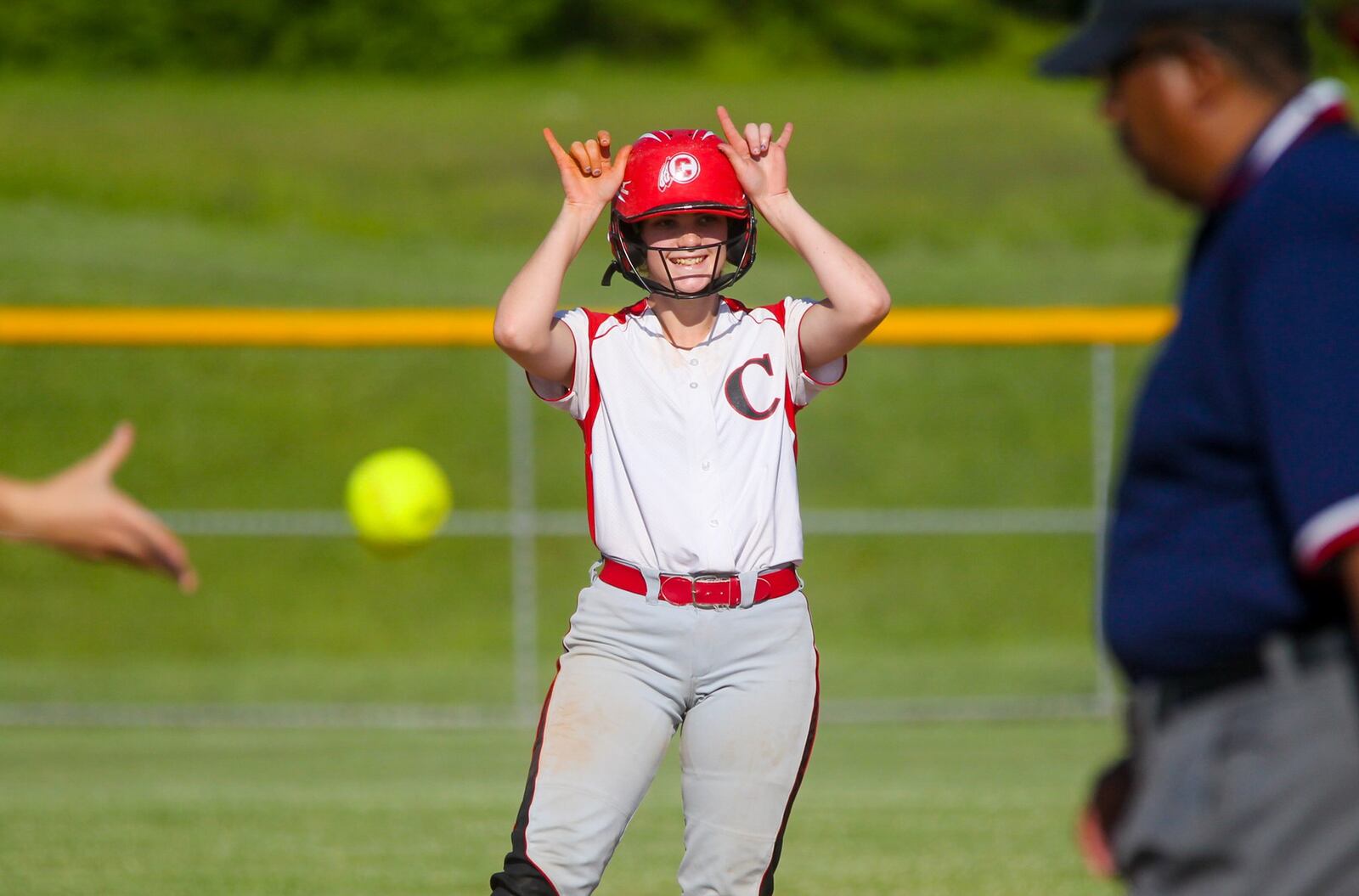 Carlisle’s Bailey Naylor (3) celebrates hitting a double Monday during a Division III sectional final against Madison at Fenwick. GREG LYNCH/STAFF