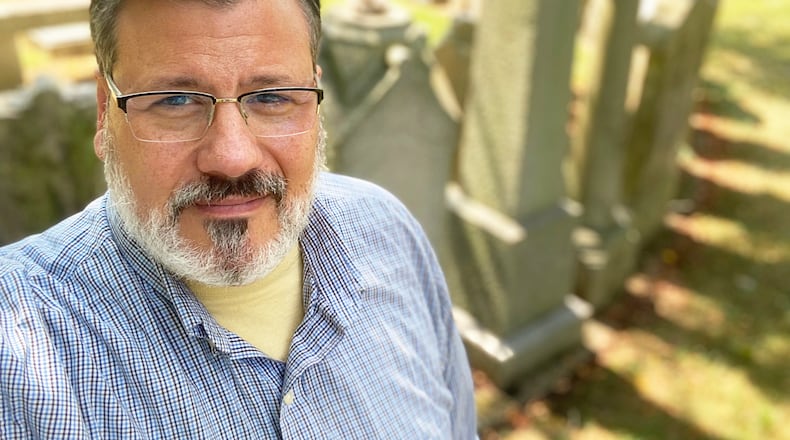 Marshall Weiss, pictured at Temple Israel’s Riverview Cemetery, spent much time exploring Dayton area’s Jewish cemeteries for research on his new book, “Stories of Jewish Dayton.” CONTRIBUTED