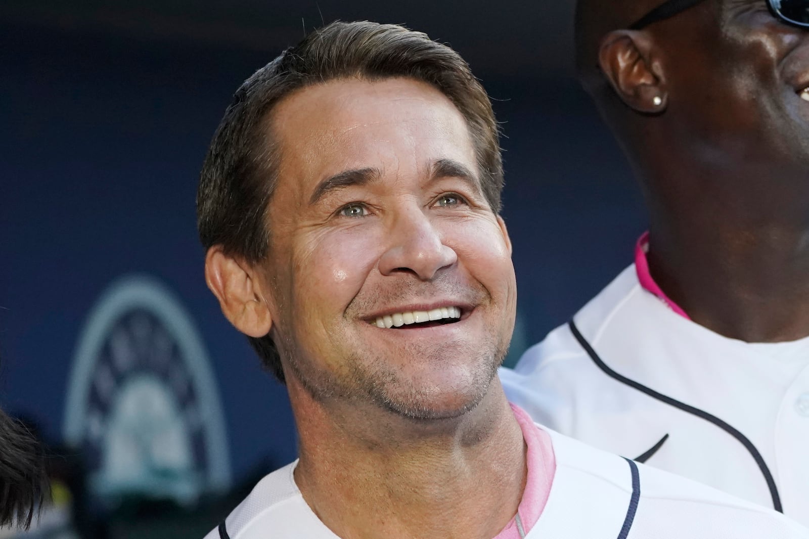 FILE - Seattle Mariners former second baseman Bret Boone stands in the dugout before throwing out ceremonial first pitches before a baseball game between the Mariners and the Houston Astros, July 22, 2022, in Seattle. (AP Photo/Ted S. Warren, File)