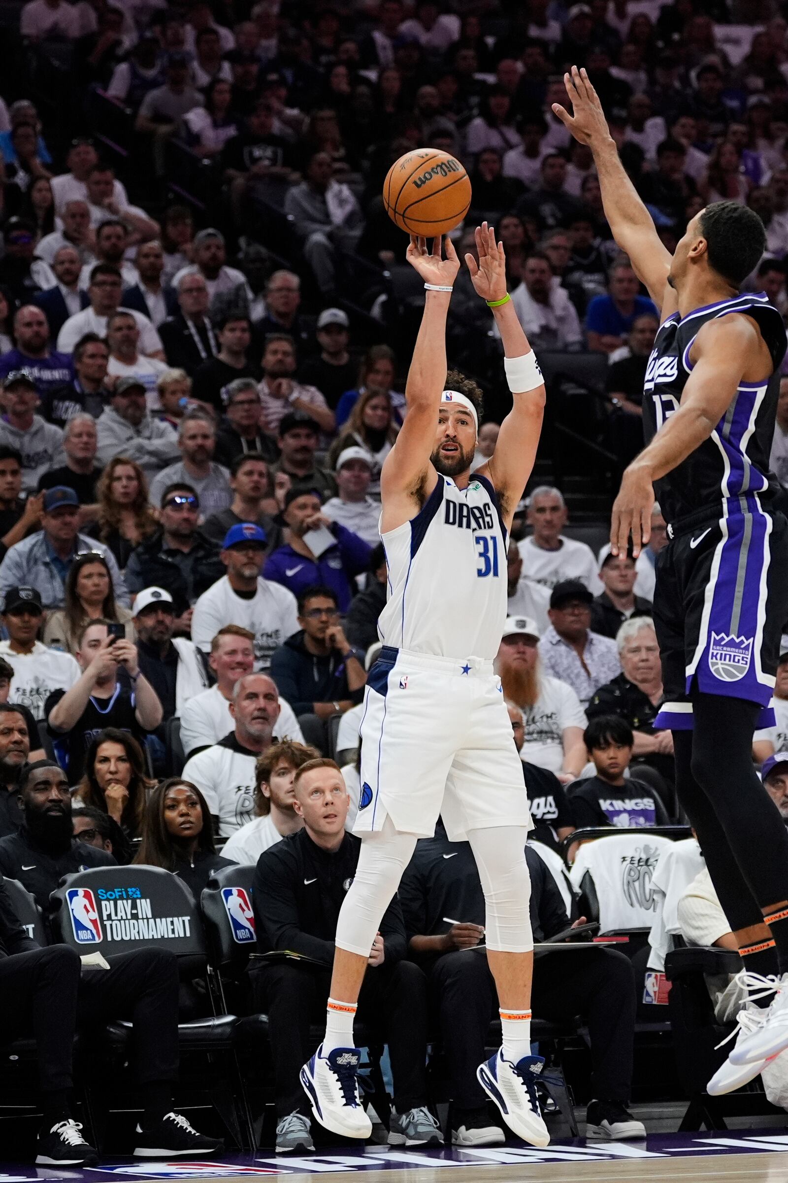 Dallas Mavericks guard Klay Thompson (31) shoots a 3-point basket next to Sacramento Kings forward Keegan Murray (13) during the first half of an NBA play-in tournament basketball game Wednesday, April 16, 2025, in Sacramento, Calif. (AP Photo/Godofredo A. Vásquez)