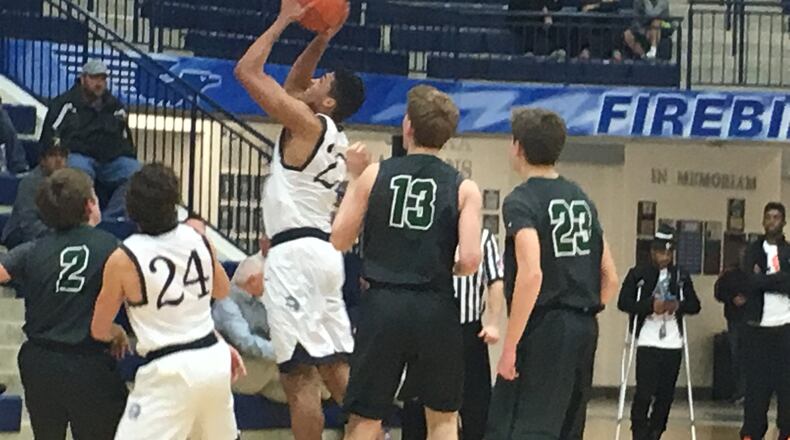 Valley View’s Tyler Whiteman (22) goes up with a shot as Badin’s Evan Grawe (2), Justin Pappas (13) and John Marot (23) watch Tuesday night during Division II sectional play at Fairmont’s Trent Arena. That’s the Spartans’ Devin Vantrease (24) also viewing the shot. RICK CASSANO/STAFF
