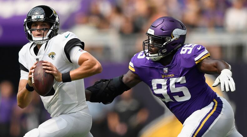MINNEAPOLIS, MN - AUGUST 18: Ifeadi Odenigbo #95 of the Minnesota Vikings gives chase to Cody Kessler #6 of the Jacksonville Jaguars during the fourth quarter in the preseason game on August 18, 2018 at US Bank Stadium in Minneapolis, Minnesota. Odenigbo got a sack on the play. The Jaguars defeated the Vikings 14-10. (Photo by Hannah Foslien/Getty Images)