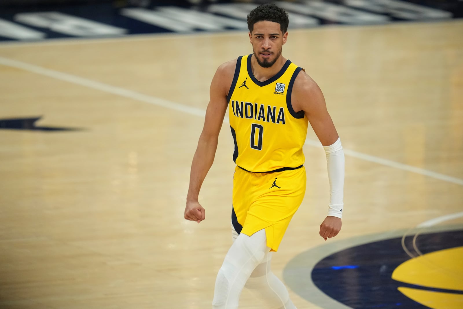 Indiana Pacers guard Tyrese Haliburton looks towards the bench after a basket during the first half of Game 6 of the NBA Finals basketball series against the Oklahoma City Thunder, Thursday, June 19, 2025, in Indianapolis. (AP Photo/Michael Conroy)