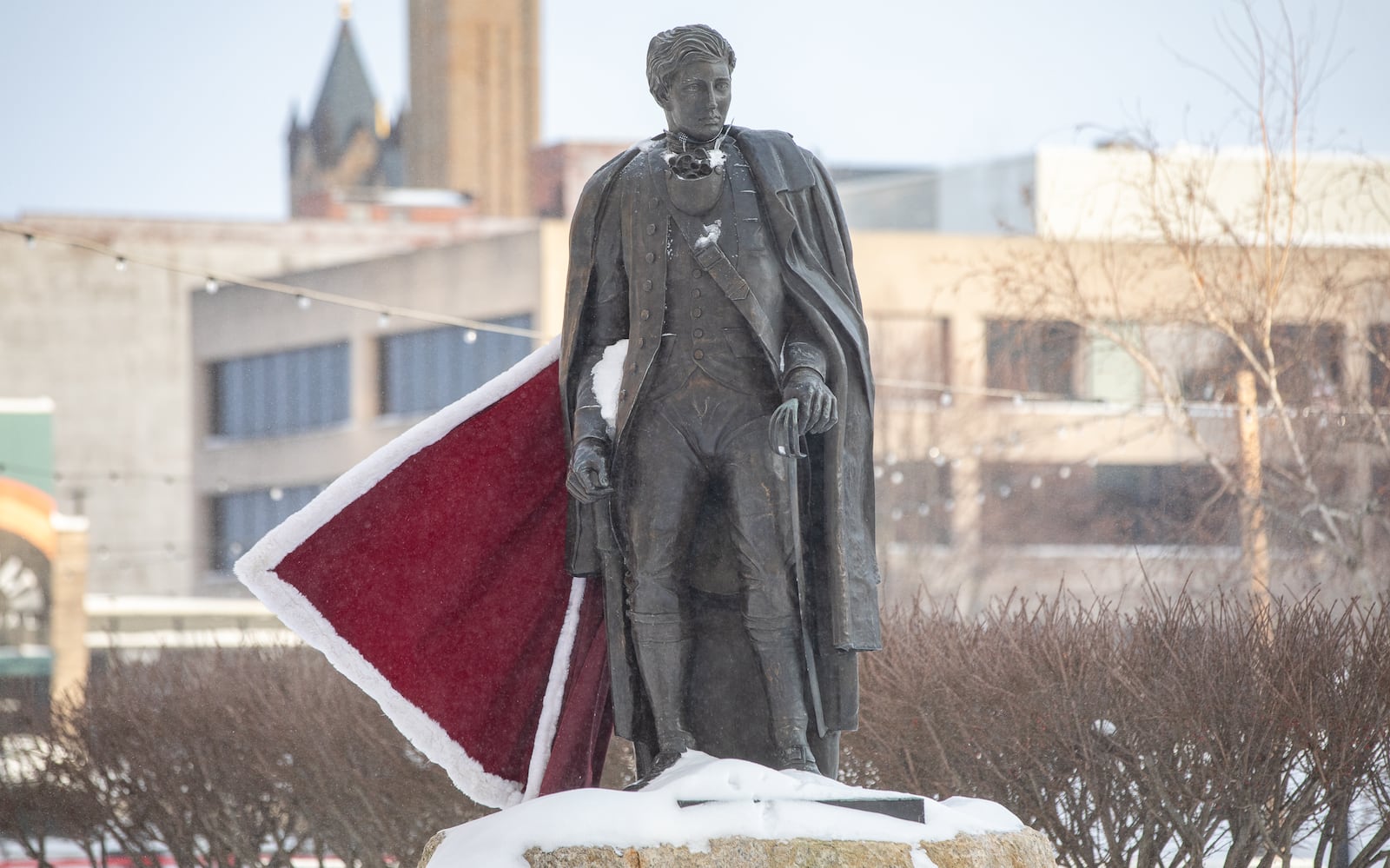 A cape affixed to the statue of George Rogers Clark blows in the wind on Tuesday, Jan. 27 in downtown Springfield. The city received 13 inches of snow over the weekend. BRYANT BILLING/STAFF
