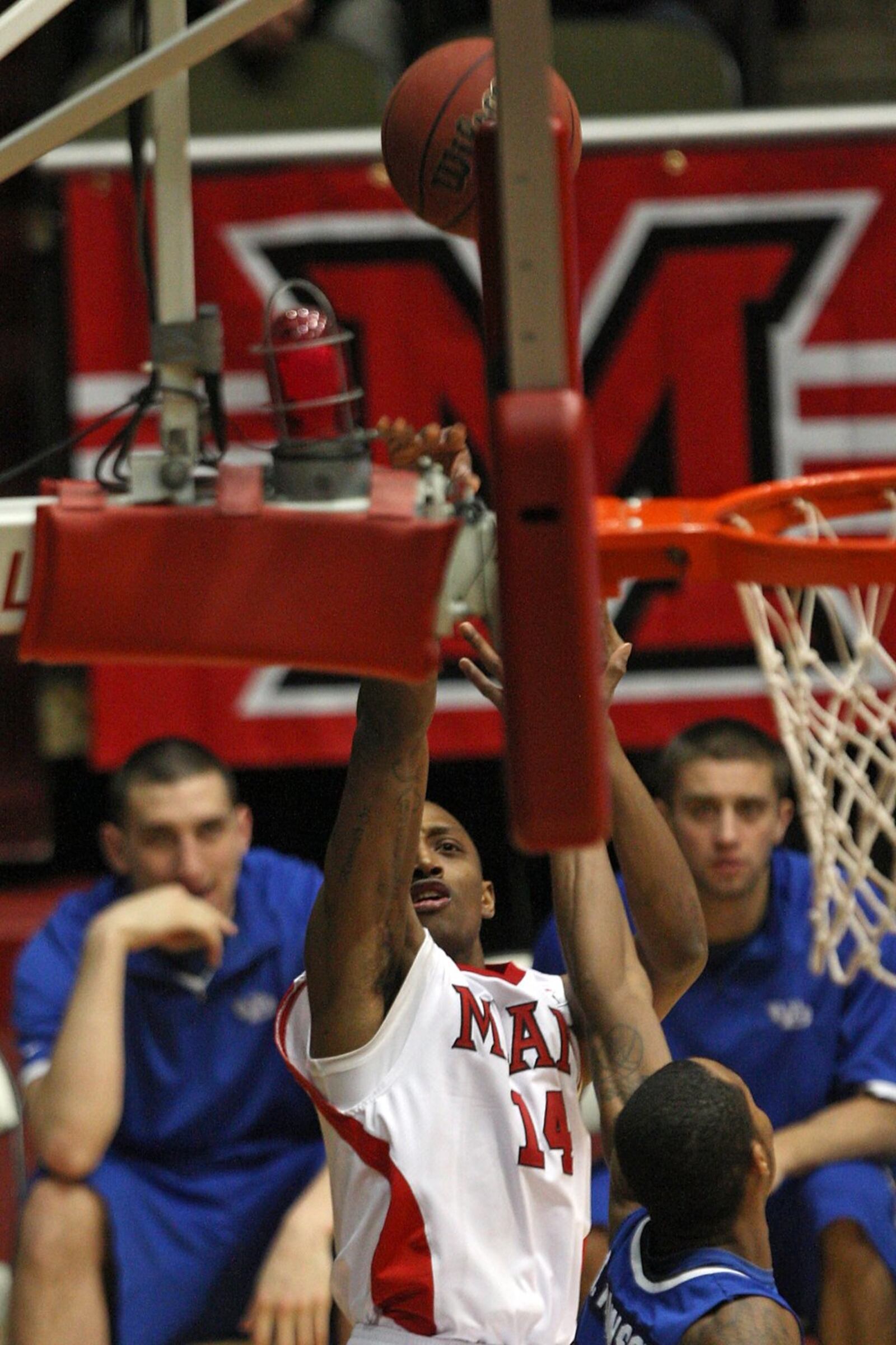 Kenny Hayes (14) of Miami (OH), knocks down a three point baseline shot, during the final home game of the season against Buffalo, Thursday, March 4, 2010, at Millett Hall, in Oxford. Photo by Robert Leifheit/Contributing Photographer