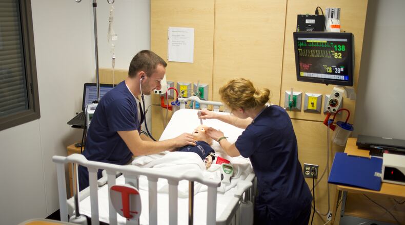 Cedarville nursing students work in a simulation lab. The university is working toward adding a doctorate of nursing practice degree. CONTRIBUTED