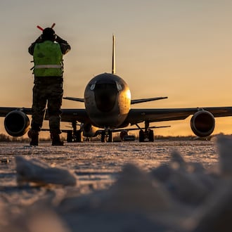 In this Jan. 28, 2026 photo, U.S. Air Force Master Sgt. Aaron Slupski, a crew chief with the 121st Maintenance Group, prepares to marshal a KC-135 Stratotanker at Rickenbacker Air National Guard Base, Columbus, Ohio. Ohio Gov. Mike DeWine said Friday that three of six crew members of an American KC-135 refueling plane were killed when it crashed in Iraq were from his state and had deployed with the Ohio Air National Guard's 121st Air Refueling Wing. (Ralph Branson, U.S. Air National Guard photo via AP)