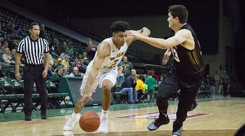 Wright State guard Mark Hughes drives to the hoop in Friday’s exhibition game.