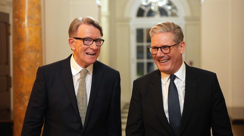 FILE - British Prime Minister Keir Starmer, right, talks with Britain's ambassador to the United States Peter Mandelson during a welcome reception at the ambassador's residence on Wednesday, Feb. 26, 2025 in Washington. (Carl Court/Pool Photo via AP, file)