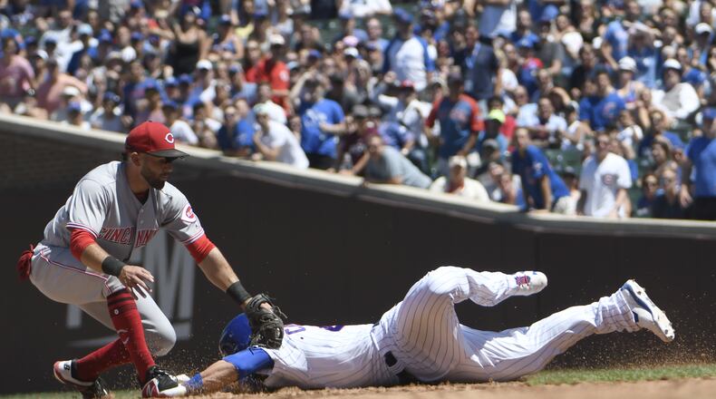 CHICAGO, IL - JULY 08:Jose Peraza #9 of the Cincinnati Reds tags out Willson Contreras #40 of the Chicago Cubs at second base during the third inning on July 8, 2018 at Wrigley Field  in Chicago, Illinois. (Photo by David Banks/Getty Images)
