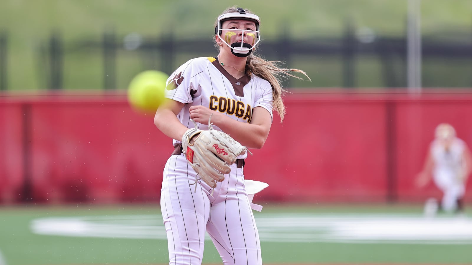 Kenton Ridge High School freshman pitcher Ivee Rastatter delivers a pitch to the plate during their Division IV state championship game against Hillsboro on Thursday, June 5 at Akron's Firestone Stadium. The Cougars won 9-0. MICHAEL COOPER / STAFF