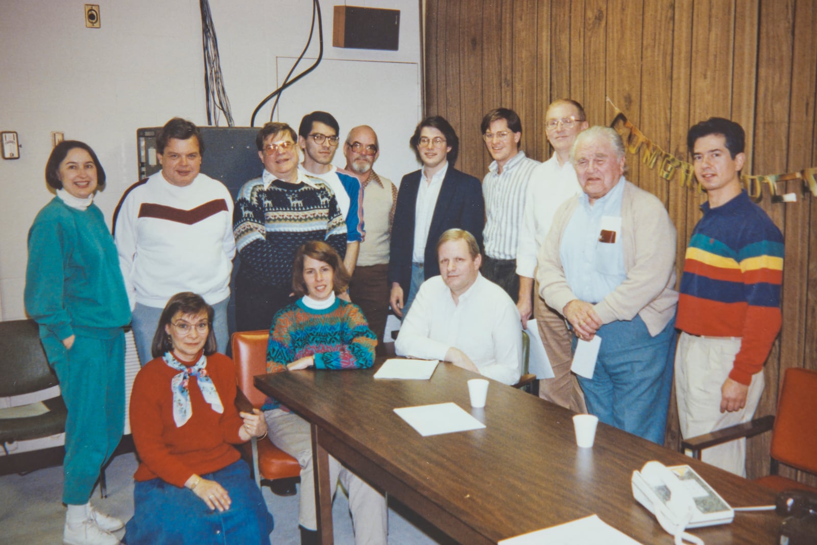 WDPR's marks its fifth birthday in  1990.  Front row (left to right)  Jenny Paxson, Anne Brown, Bill Combs.  Back row:  Susan Sauer, Roland Marcus, Ron Davidson, Adam Alonzo, Paul Spiegel, Larry Coressel, Michael Weiser, Charles Knight, Don Vandenberg, Ken Kohlenberg.