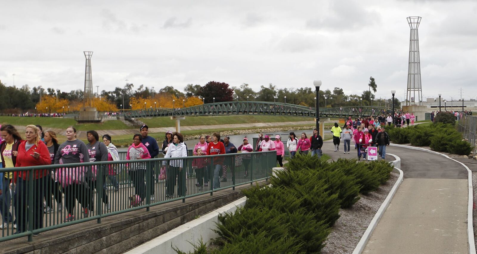 Participants approach Fifth Third Field during a past Making Strides Against Breast Cancer Walk in Dayton. TY GREENLEES / STAFF