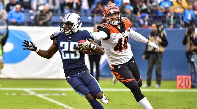 NASHVILLE, TN - NOVEMBER 12: Corner Back Adoree’ Jackson #25 of the Tennessee Titans carries the ball against Long Snapper Clark Harris #46 of the Cincinnati Bengals at Nissan Stadium on November 12, 2017 in Nashville, Tennessee. (Photo by Frederick Breedon/Getty Images)