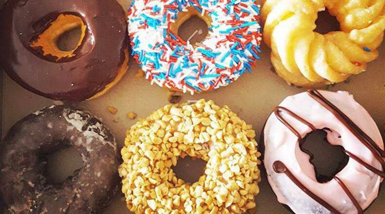 Tim Hortons and Dunkin' Donuts are competing against each other and independent doughnut shops in the Dayton area.