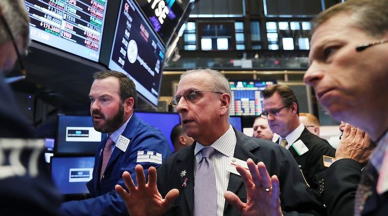 Traders work on the floor of the New York Stock Exchange. Photo/Getty Images