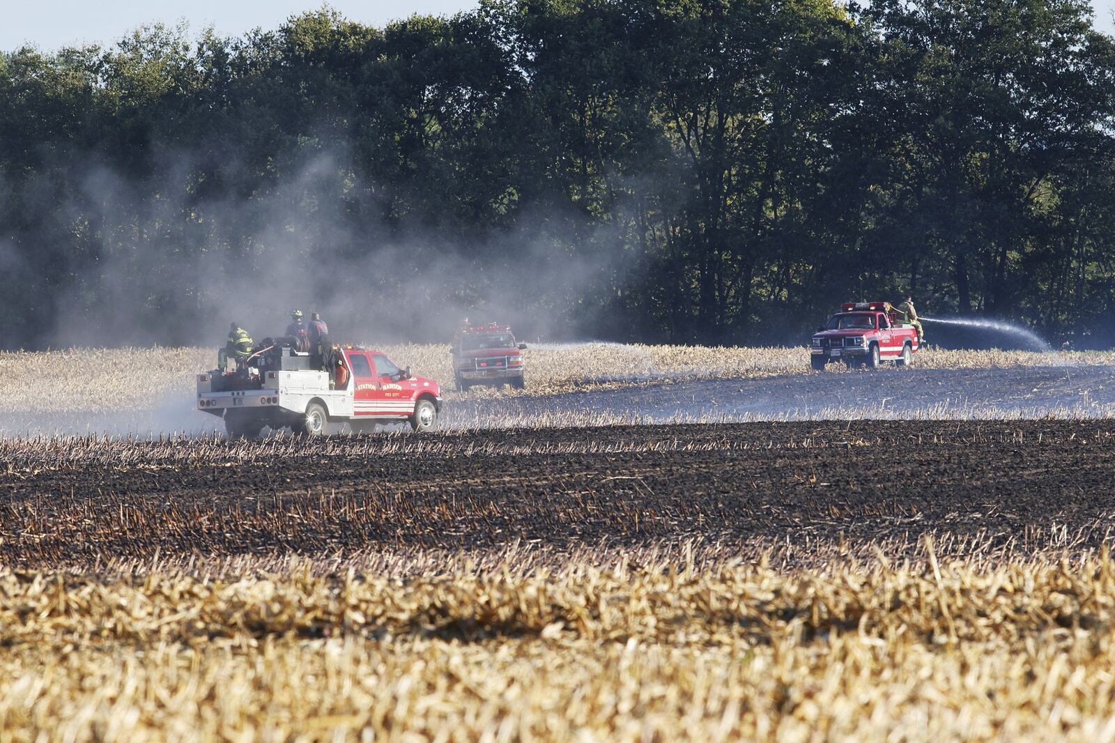Multiple fire departments fight a field fire near Farmington Road and S Butter Street in German Twp. NICK GRAHAM / STAFF