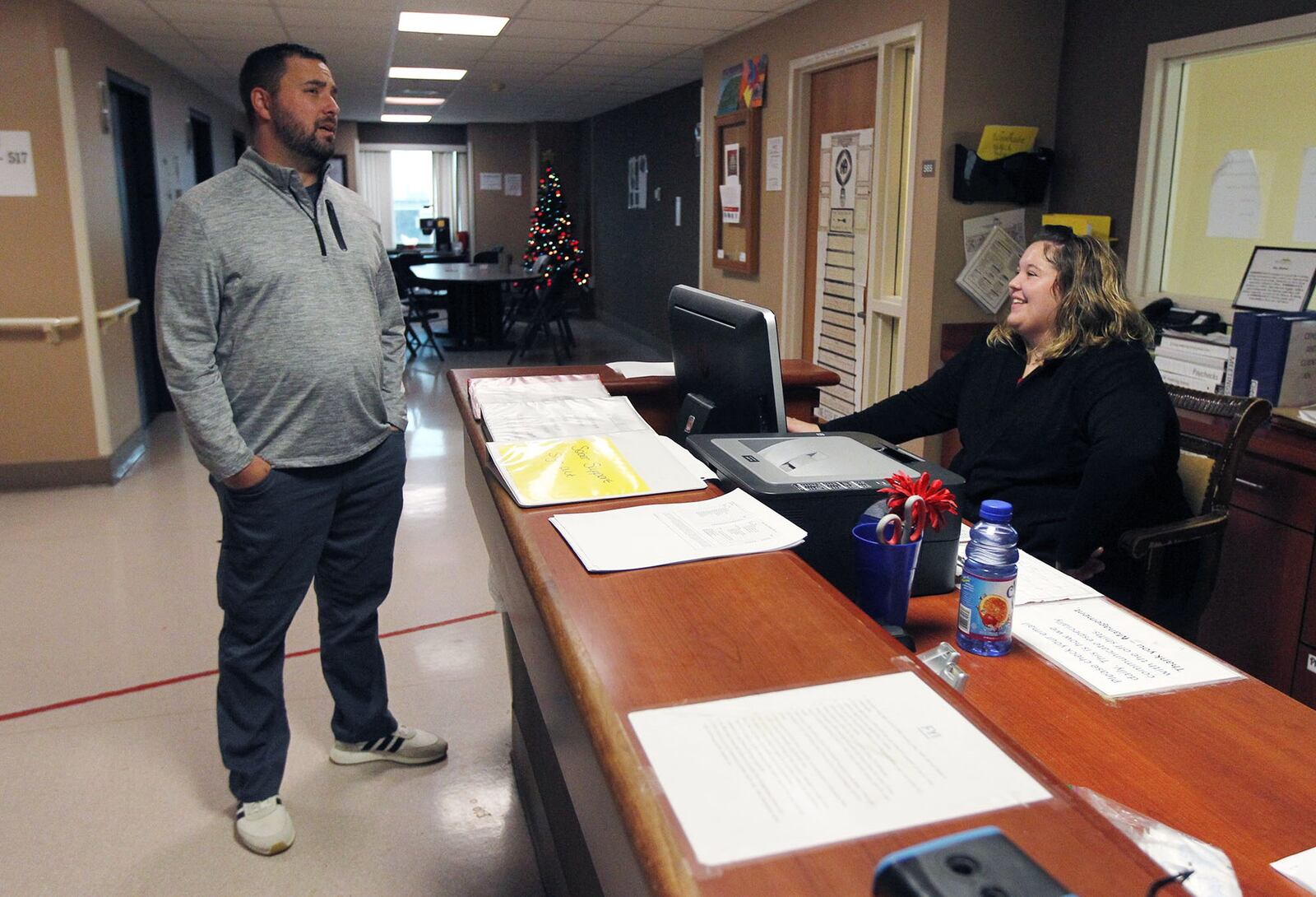 Woodhaven Residential Treatment Center president Jade Chandler, left, talks with Mandy Andrews, residential assistant. Woodhaven is certified by the state of Ohio for addiction treatment services and has gained CARF accreditation, which is considered the "gold standard" in the industry.   TY GREENLEES / STAFF