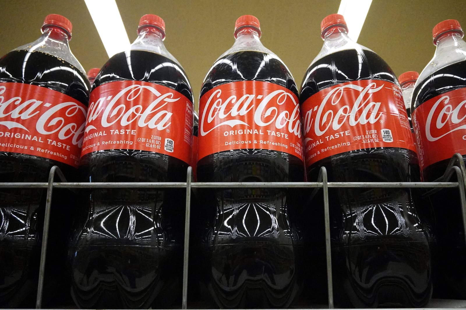 Bottles of Coca-Cola are displayed at a grocery store in Mount Prospect, Ill., Thursday, July 17, 2025. (AP Photo/Nam Y. Huh)