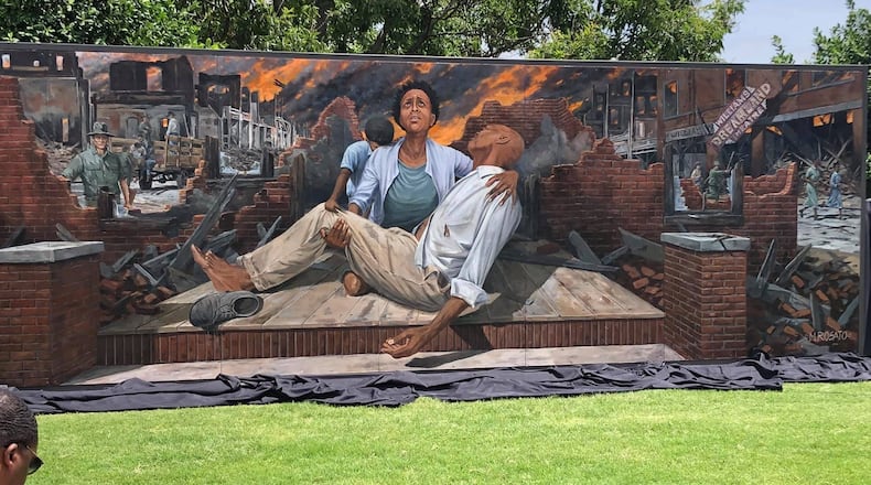 The mural depicting the 1921 Tulsa Race Massacre was painted by artist Michael Rosato and is opposite the Greenwood Cultural Center. CONTRIBUTED