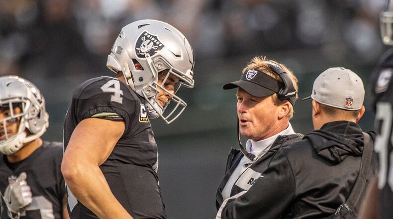 Oakland Raiders quarterback Derek Carr (4) talks with Oakland Raiders head coach Jon Gruden during the second half against the Pittsburgh Steelers on Sunday, Dec. 9, 2018 at the Oakland-Alameda County Coliseum in Oakland, Calif. (Hector Amezcua/Sacramento Bee/TNS)