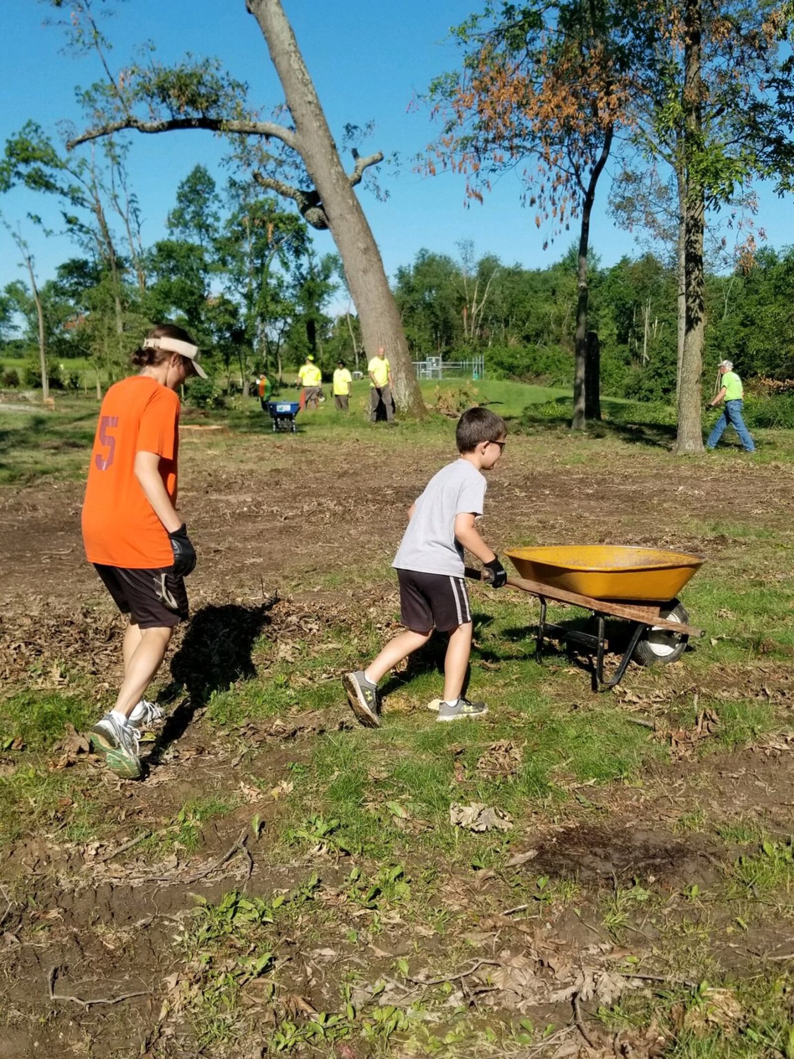 Volunteers gathered Friday, June 21, 2019, to clean up the Russ Nature Reserve in Beavercreek after it was significantly damaged in the Memorial Day tornadoes. LYDIA BICE/STAFF