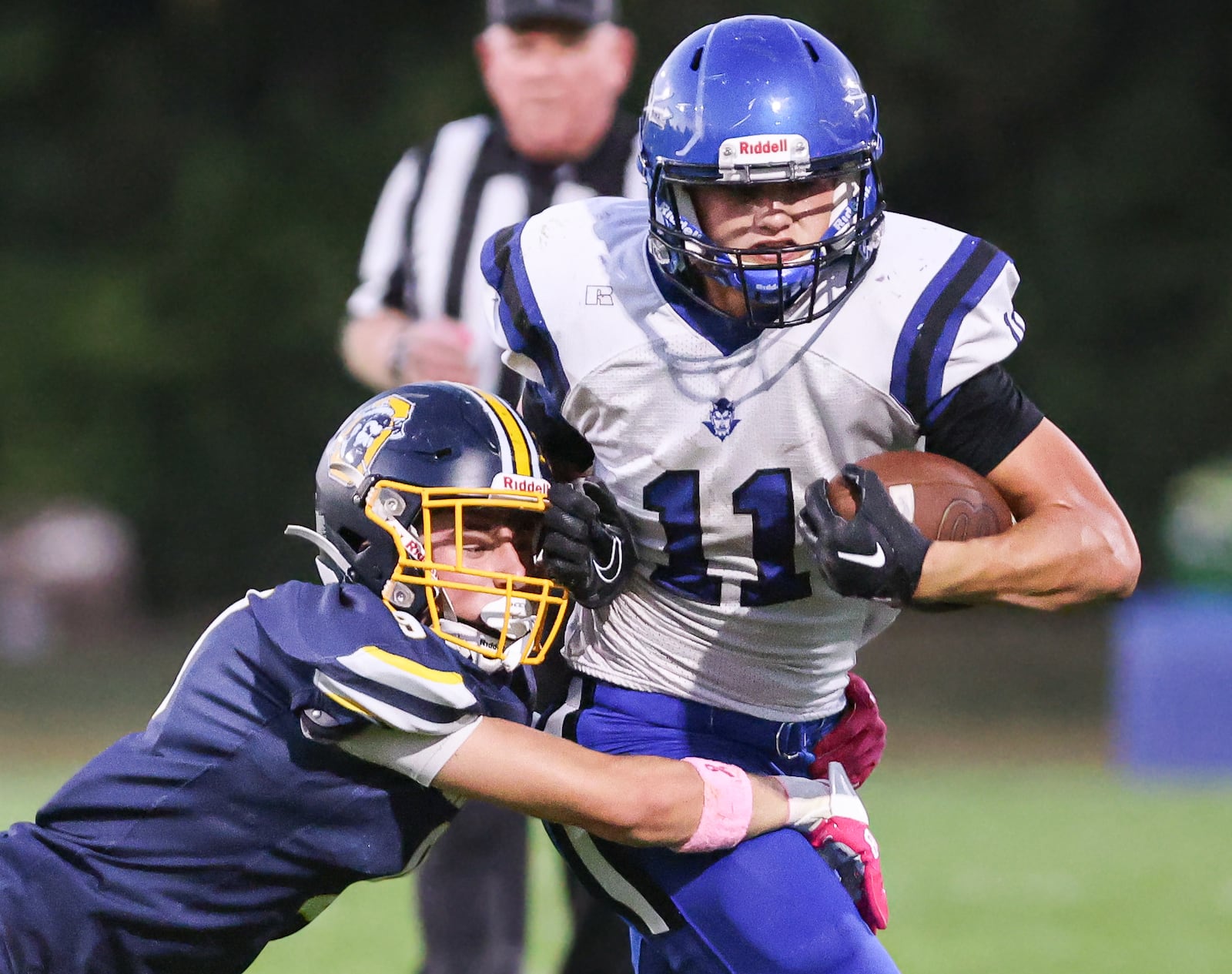 Brookville senior running back Aden Lamb fights for extra yardage Oakwood's Urban Kummerer tackles him during a Southwestern Buckeye League game on Friday, Oct. 3  at Mack Hummon Stadium. BRYANT BILLING / STAFF