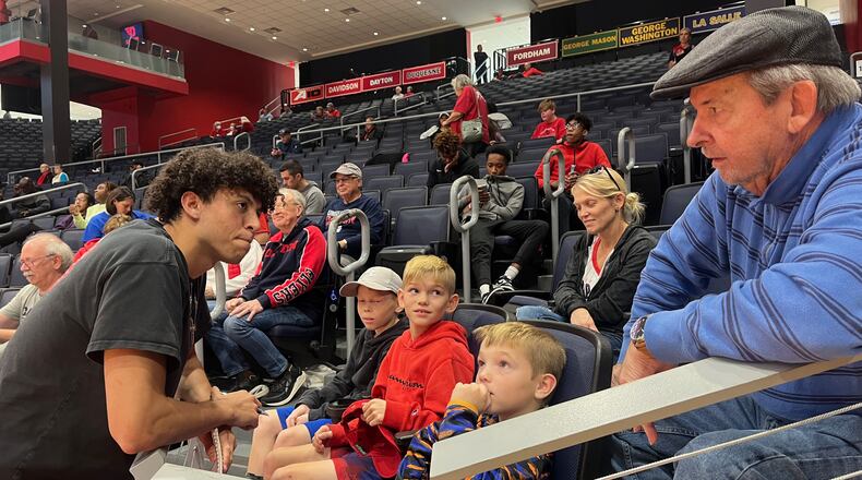 Chaminade Julienne senior George Washington III, left, talks to fans at UD Arena during the Red & Blue Game on Oct. 15, 2022. David Jablonski/Staff