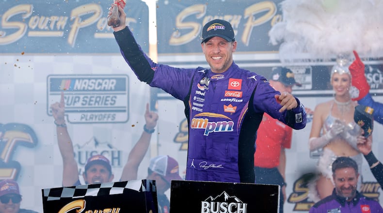 Denny Hamlin celebrates in victory lane after winning a NASCAR Cup Series auto race Sunday, Oct. 12, 2025, in Las Vegas. (AP Photo/Steve Marcus)