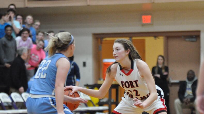 Fort Loramie’s Kenzie Hoelscher squares off against Legacy Christian sophomore Katie Leach during Loramie’s 47-39 victory against Legacy Christian in a Division IV regional semifinal contest at Butler High School March 7, 2019. Nick Dudukovich/CONTRIBUTED