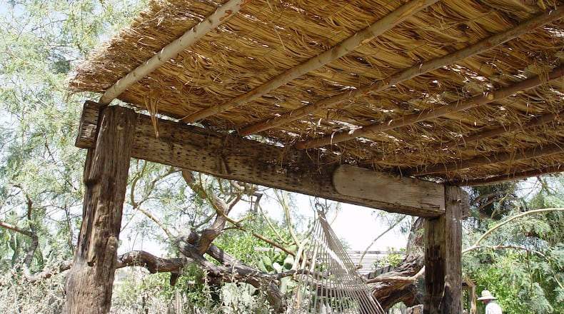 This simple method of creating shade is to lay fencing over the top rafters and wire palm fronds or brush securely against wind. (Handout/TNS)