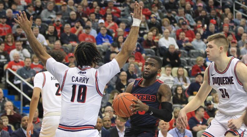Dayton's Jalen Crutcher drives to the basket and reached the 1,000-point milestone with a layup on the first possession of the game against Duquesne on Wednesday, Jan. 29, 2020, at PGG Paints Arena in Pittsburgh.