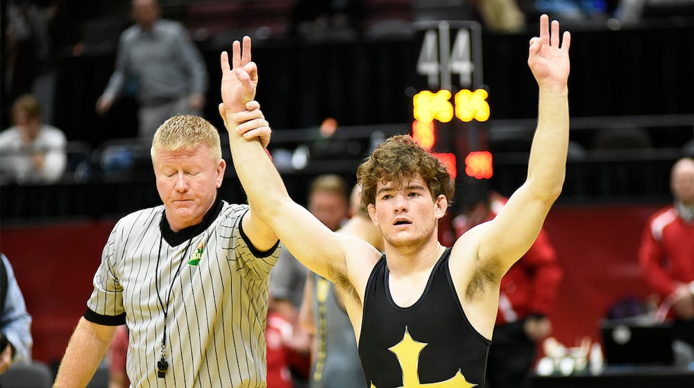 Legacy Christian senior Nathan Attisano celebrates after winning his third consecutive state title at the OHSAA State Wrestling Championships on Sunday, March 15, 2026 at Ohio State University's Schottenstein Center. GEOFF NEVILLE / CONTRIBUTING WRITER