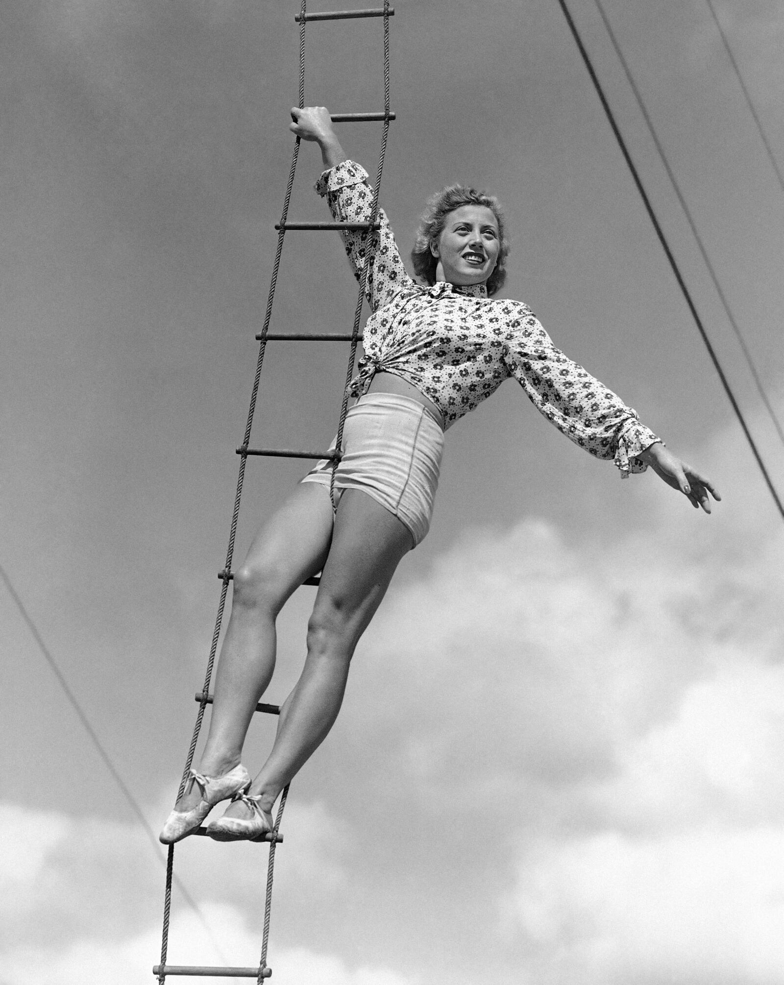 In this Feb. 28, 1945 photo, Elizabeth Wallenda pauses on an aerial ladder during rehearsal for her return to the Wallenda troupe’s high wire act with the Ringling Brothers and Barnum and Bailey Circus, now in winter quarters in Sarasota, Fla. The Ringling Bros. and Barnum & Bailey Circus will end “The Greatest Show on Earth” in May 2017, following a 146-year run of performances. (AP Photo/Earl Shugars)